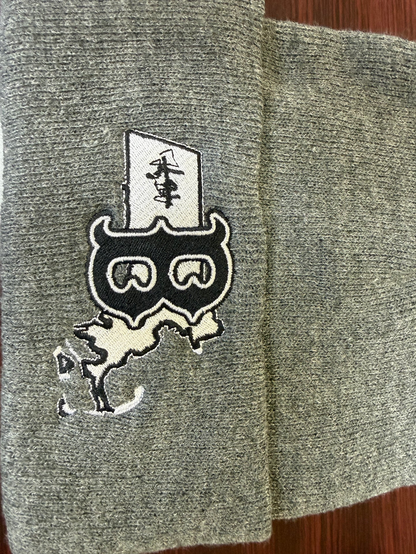 Gray folded rim winter hat with unique design